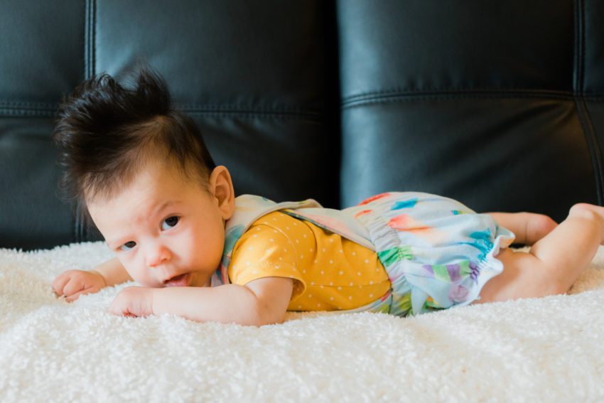 3 month old in popsicle overalls and mustard shirt