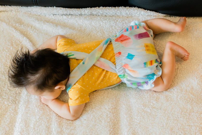 3 month old in popsicle overalls and mustard shirt