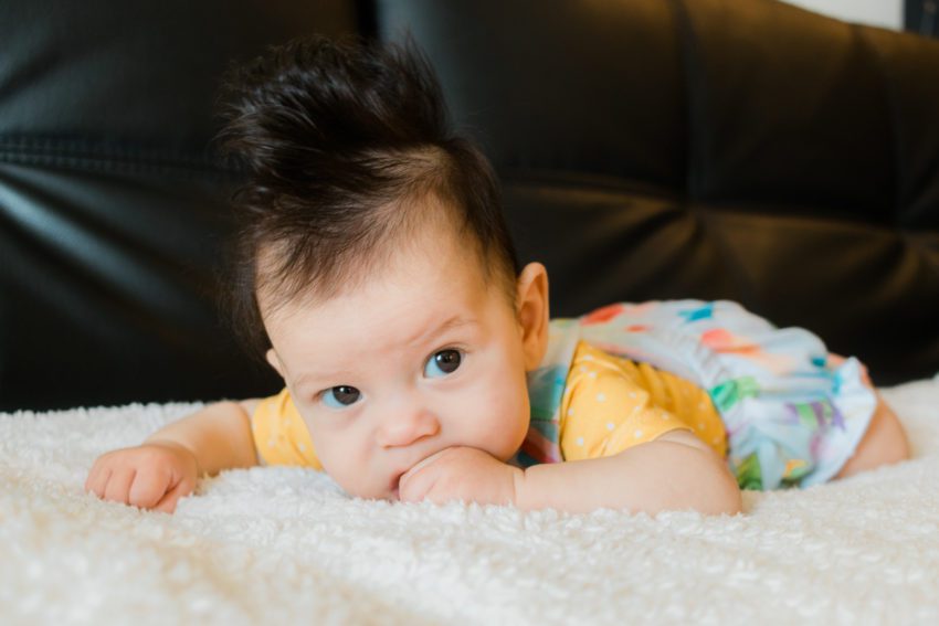 3 month old in popsicle overalls and mustard shirt